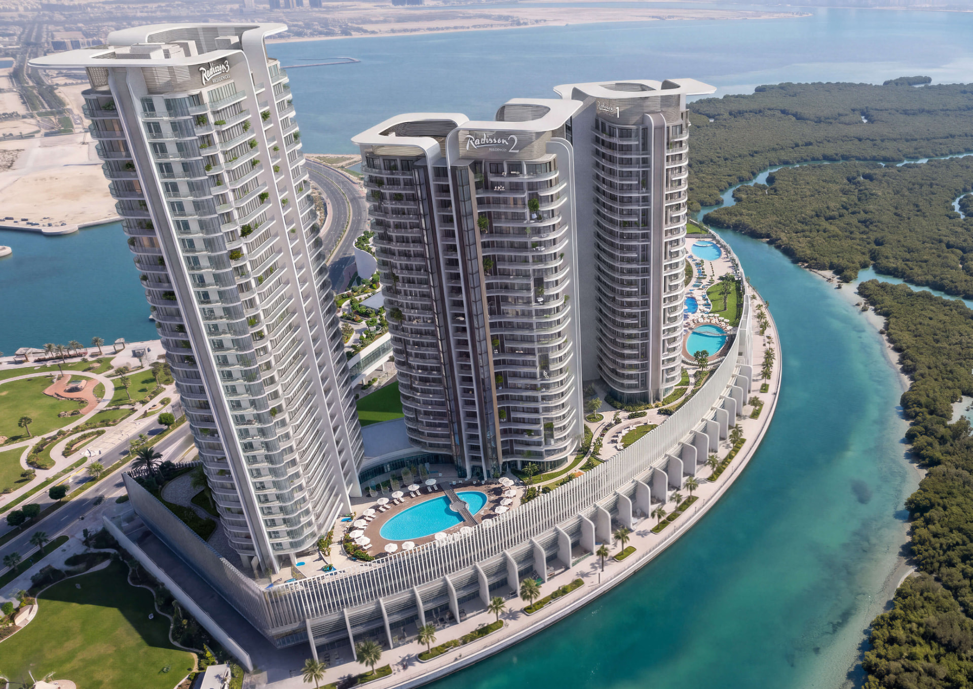 Aerial view of the three Radisson Residences towers on Al Reem Island beside the mangrove channels