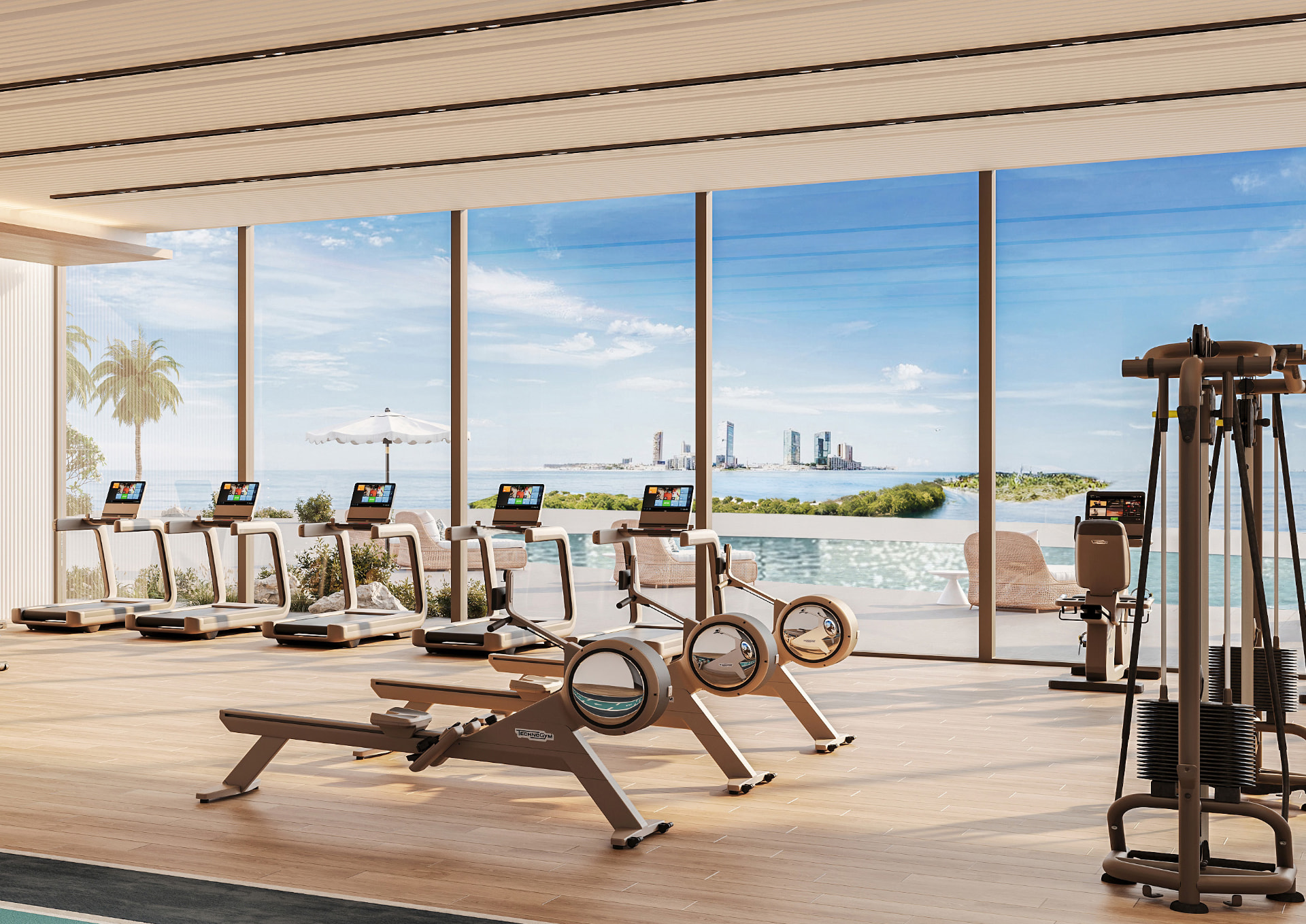 Fitness floor with floor to ceiling glass facing the pool and skyline